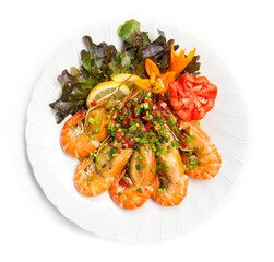 Shrimp Stir fried with chili slice and salt Thai food fusion decorate with carved tomato and yellow chili vegetables, leaf red oak  top view isolated on white background