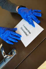 Coronavirus quarantine sign on the apartment door.