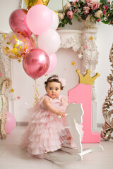 Fototapeta premium Baby girl at pink dress
