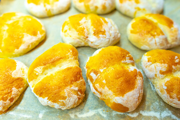 Handmade delicious fresh rolls with crusty tops. Fresh rolls from the oven.