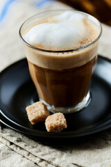 Coffee with milk on linen background.	Close up. 