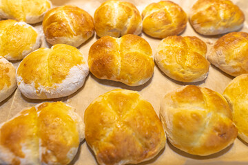 Fresh baked dinner rolls closed-up, Home baked bread buns stacked in a pile
