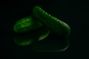fresh cucumber isolated on black background