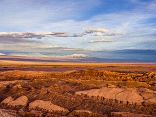 Fototapeta na wymiar Colourful sunset near Andes Mountains in Mars like landscape at the valley of the Moon (Valle de la Luna) in Chile, South America