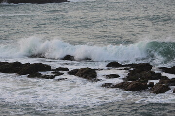 A Beautiful Milky sea waves are trying to hit the Brownie Rocks at Indian Ocean of KanyaKumari