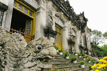 Lion statue in front of a cultural old building, Vietnam