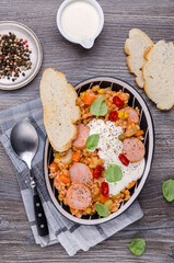 Stewed rice with beans, sausages and vegetables