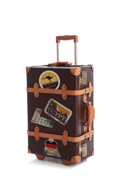 Retro Suitcase With Travel Stickers On White Background