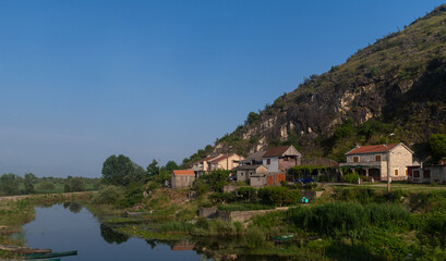 Fototapeta na wymiar A small village on a hill near a lake in Montenegro