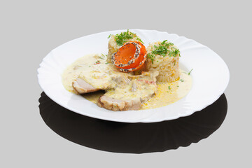 Romanian traditional dishes - pork steak with rice and mushrooms sauce