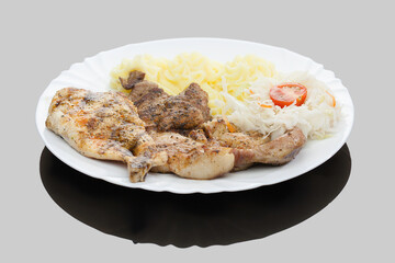 Chicken and pork grilled steaks with mashed potatoes and cabbage salad