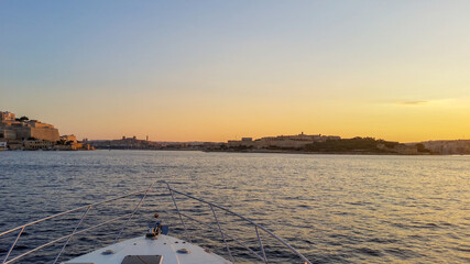 Arriving back to the marina at sunset - view from a yacht