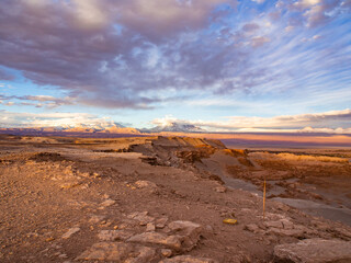 Fototapeta na wymiar Colourful sunset near Andes Mountains in Mars like landscape at the valley of the Moon (Valle de la Luna) in Chile, South America