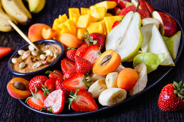 Rainbow fruit platter of fresh fruits and berries