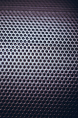 Speaker lattice metal background, close-up. Selective focus image.