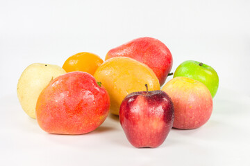 Mango and apples isolated on a white background