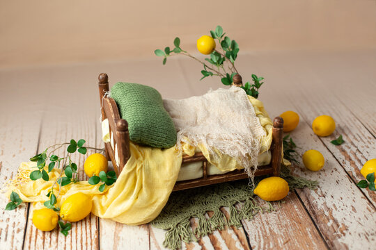 the wooden bed is decorated with lemons. props for newborn photo sessions. lemons. background for a photo shoot. furniture for dolls