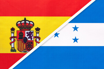 Spain and Honduras, symbol of two national flags from textile. Partnership between European and American countries.