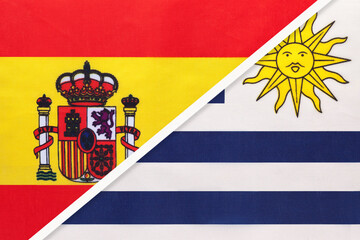 Obraz premium Spain and Uruguay, symbol of two national flags from textile. Partnership between European and American countries.