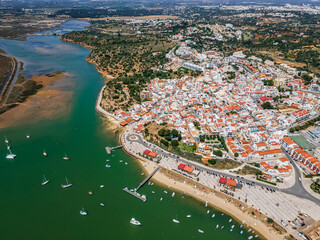Naklejka premium Aerial view of nature and city of Alvor, Algarve, Portugal