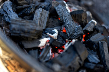 glowing charcoal on grill outsides