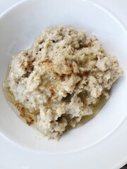 Oatmeal with honey and cinnamon on the table