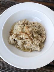 Oatmeal with honey and cinnamon on the table