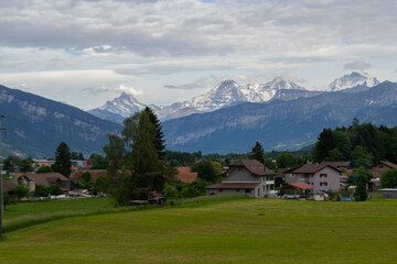 Fototapeta na wymiar view of alpine mountains and village in Switzerland