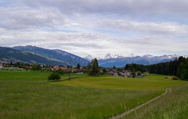 Fototapeta na wymiar view of alpine mountains and village in Switzerland