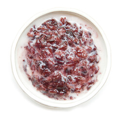 Thai Dessert Sweet Black Sticky Rice steamed or boiled (Khao Nuaw Dum) with coconut milk and sugar Thai delicious sweet .Thai cuisine the most popular of Thailand top view isolated on white background