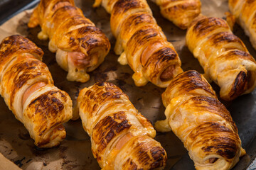 Homemade pastries, sausages in the dough with their own hands, appetizing and simple recipe.