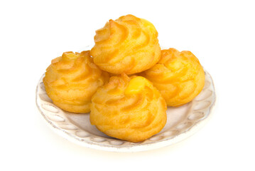 Eclair Dessert, filling Vanilla flavour is homemade style on white plate side view isolated on a white background