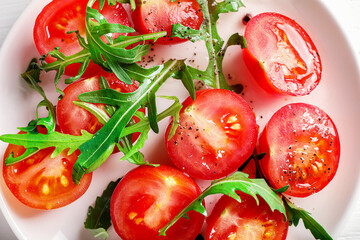 Fresh cherry tomatoes and arugula