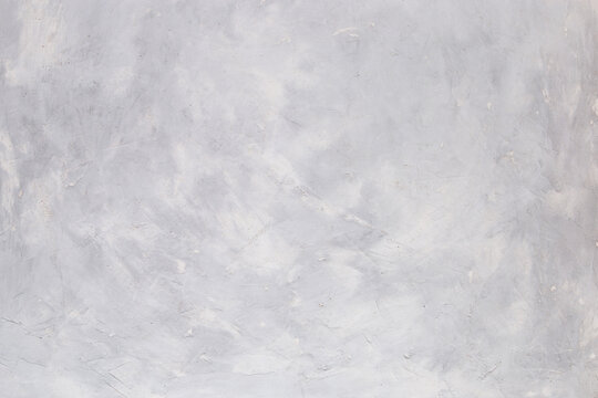 Light concrete background, wall with texture, preparation for design. Copy space.