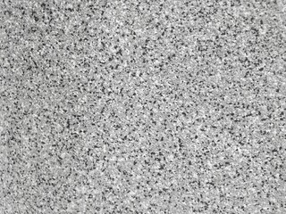 The pigment of the plastic spreads into small dots.abstract background.The surface is rough.monochrome color.