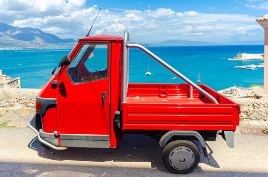 Gaeta, Italy. August 12th 2017. A red Ape parked in a scenic road in Gaeta.