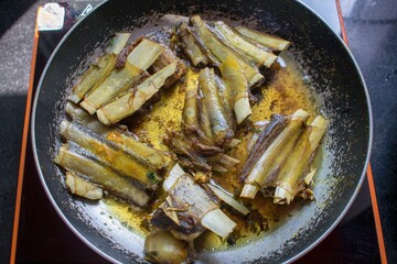 Tabak maaz lamb ribs is a popular kashmiri dish made of lamb ribs marinated in spiced yogurt boiled and pan-fried till golden brown in ghee