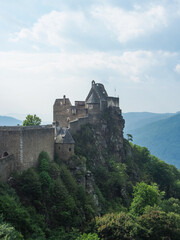 Fototapeta na wymiar Ruins of castle Aggstein on a hill near Danube river on a cloudy day, Austria