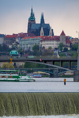 Rainy day in Prag at the shore of the Moldau river with view at the city