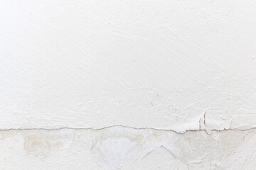 Blank concrete white rough wall for background. Beautiful white wall with cracks and dirty.