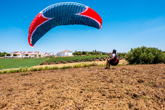Man trying to take off the paraglider