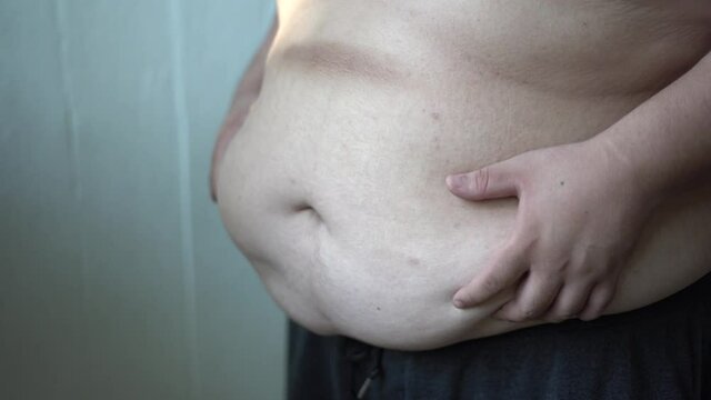 Fat man holding fat belly
