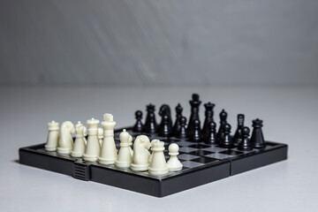 Chess, white and black on the Board, close-up.