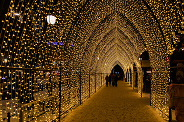Illuminated crossing during Christmas holiday in Oslo Norway during winter all covered with fresh snow during evening time - obrazy, fototapety, plakaty