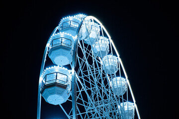 Biggest Ferris wheel in Brno, Czech Republic in Moravske square during set up for Christmas event captured at night time