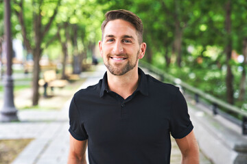 Fototapeta premium Portrait of a trendy young man on a sunny day in the city