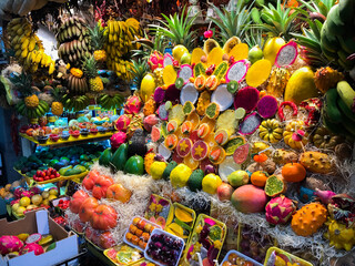 Stall with free sale of fruits of different kinds in a stall with beautiful fresh pieces of fruits and vegetables.