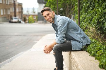 Obraz premium Portrait of a trendy young man on a sunny day in the city