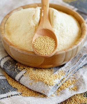 Bowl of raw Amaranth flour with a spoon of Amaranth seeds