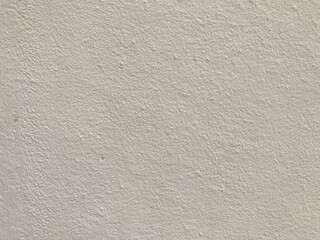 Black mold and yellow stain on old yellow cracked cement wall. Wall cracks that cause mold on the paint.